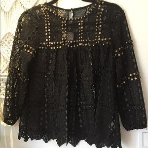Anthropologie-Maeve black top with gold hardware.